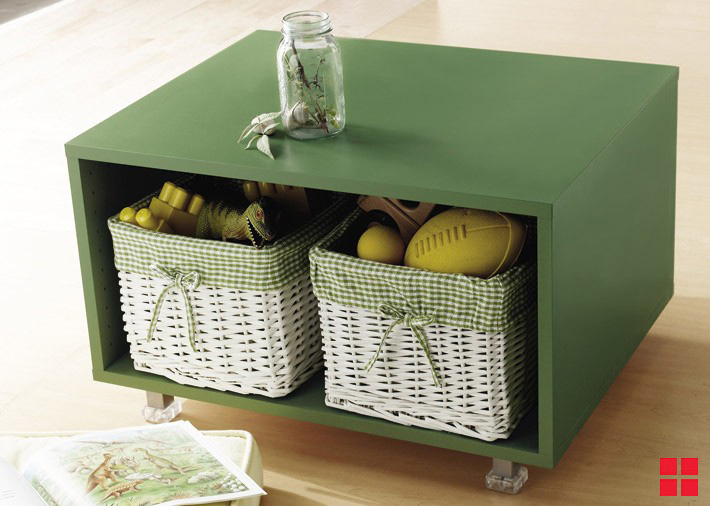 Green wooden storage box with two wicker baskets in it. 