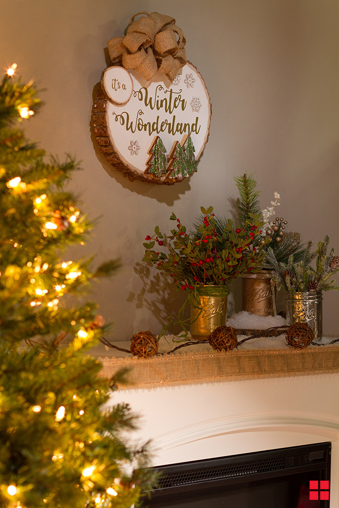 Winter wonderland wood wreath hanging on a wall.