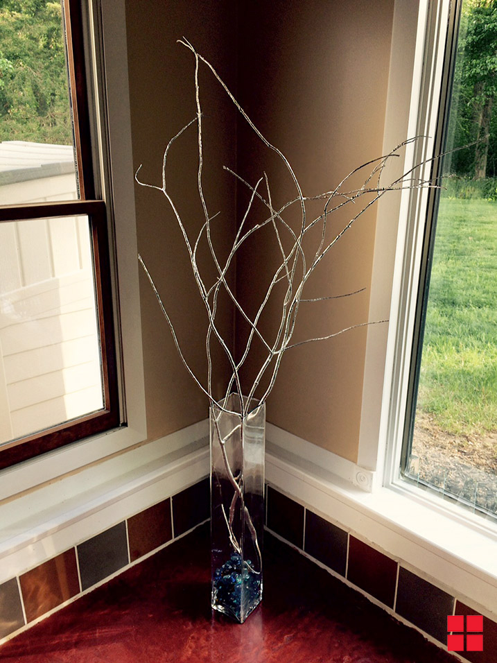 Decorative branches sprayed chrome and in vase