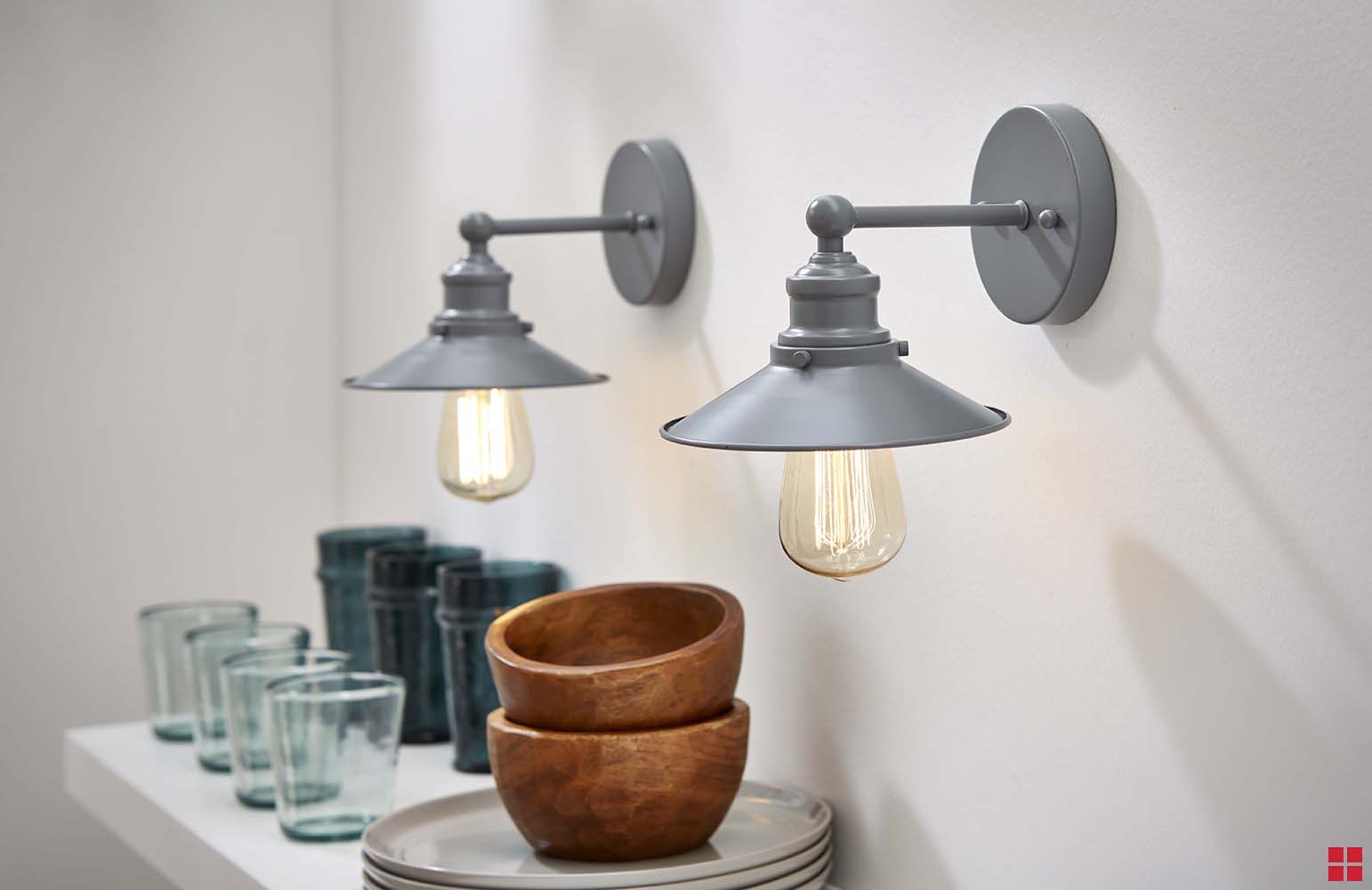Two gray wall-mounted light fixtures. 