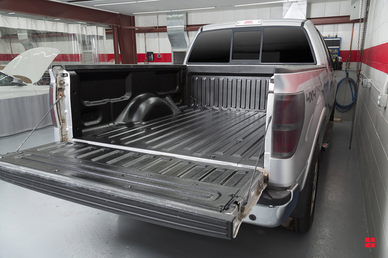 A clean, black pickup truck bed after it was coated with Rust-Oleum Truck Bed Coating. 