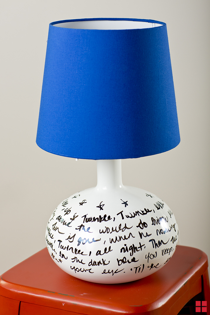 Lamp with blue lamp shade and base painted with white dry erase paint