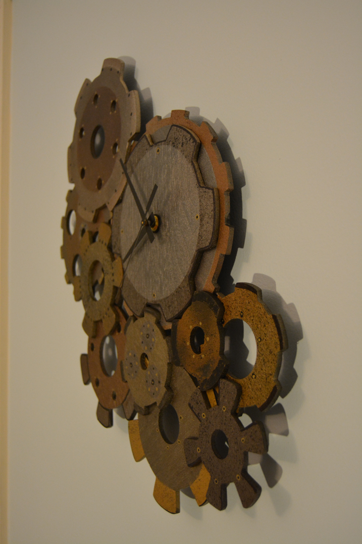 clock made of wood to look like metallic gears