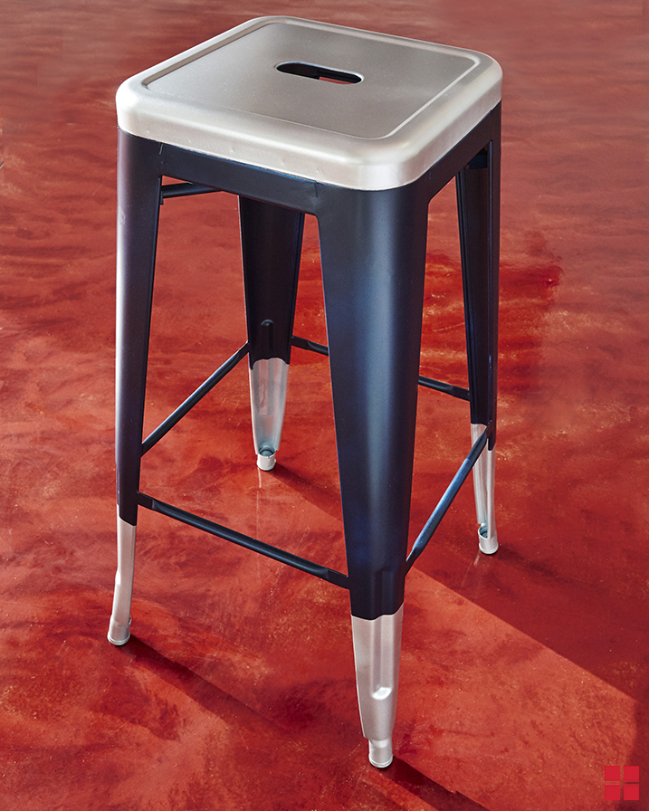 Metal barstool spray painted with Rust-Oleum Stops Rust Metallic in Silver and Stops Rust Satin in Classic Navy