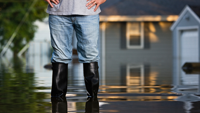 Person in rainboots in standing water.