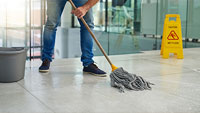 Person mopping a floor.
